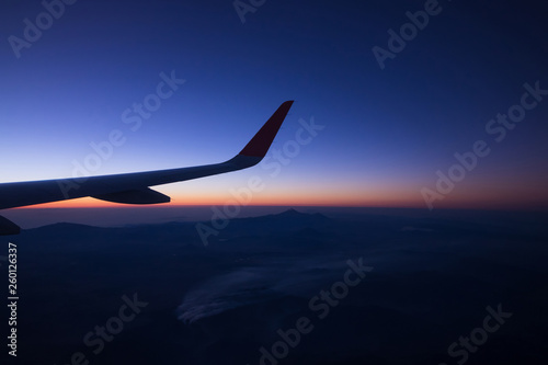 Sunrise on window plane wiew, with mountains on the background in the region of Cancun