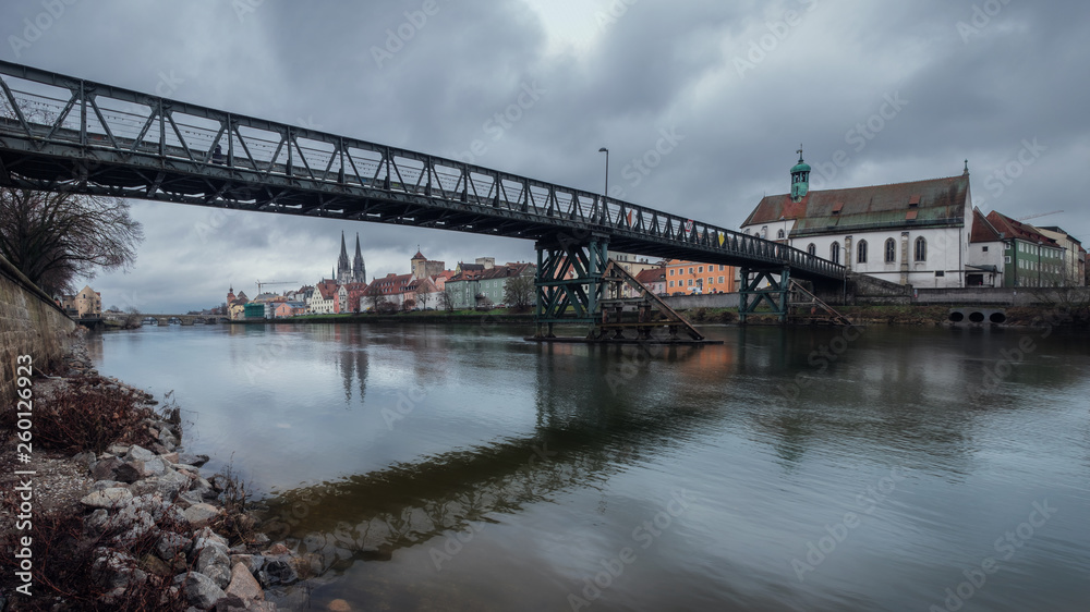 Panorama view from Danube on the bridge Eiserner Steg Regensburg and old town