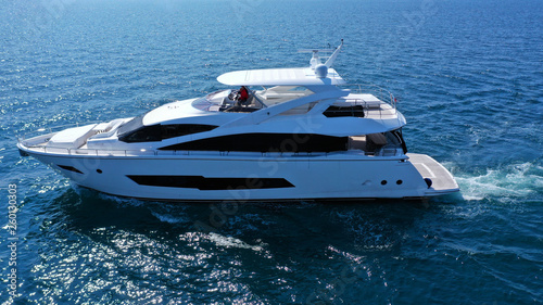 Aerial drone photo of luxury yacht cruising in mediterranean deep blue sea