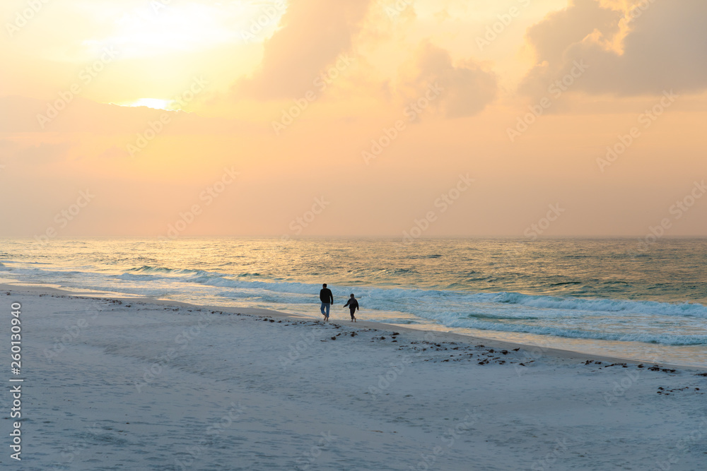 Man with Son at Beach on Sunrise
