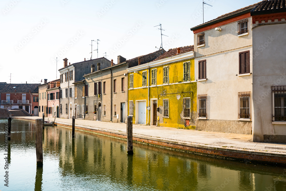 canal and colorful houses in Comacchio, Italy