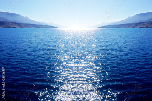 Tablou pe pânză Abstract blue big dimension background with sea, sky and with white sun which en
