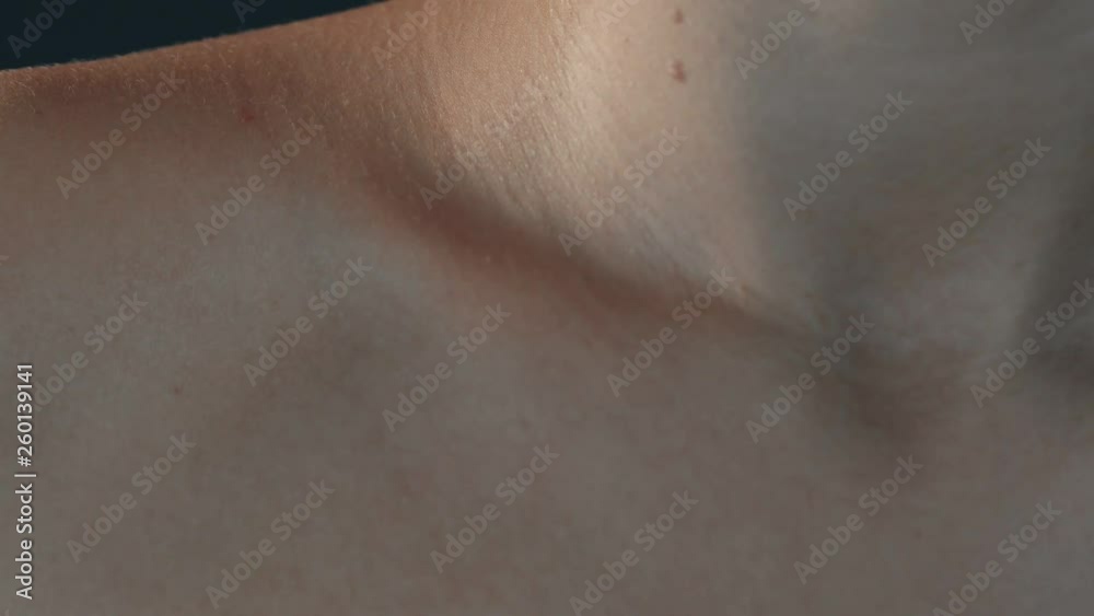 young beautiful woman with jewelry on her neck turns to the camera young beautiful woman with jewelry on her neck turns to the camera