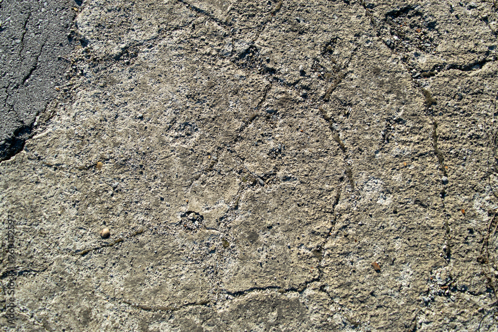 Fototapeta premium Cracked old cement texture and stone