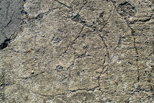 Cracked old cement texture and stone