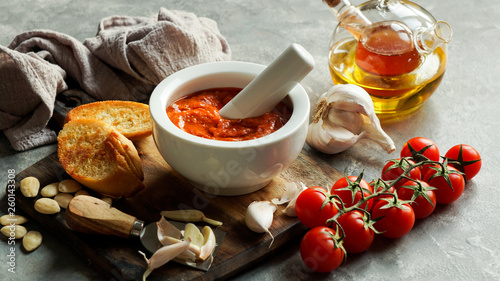 Romesco sauce, typical from Catalonia, Spain. Prepared with nora peppers, almonds, hazelnuts, garlic and tomato. photo