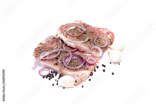Marinated meat, with onions and spices, isolated on white background.