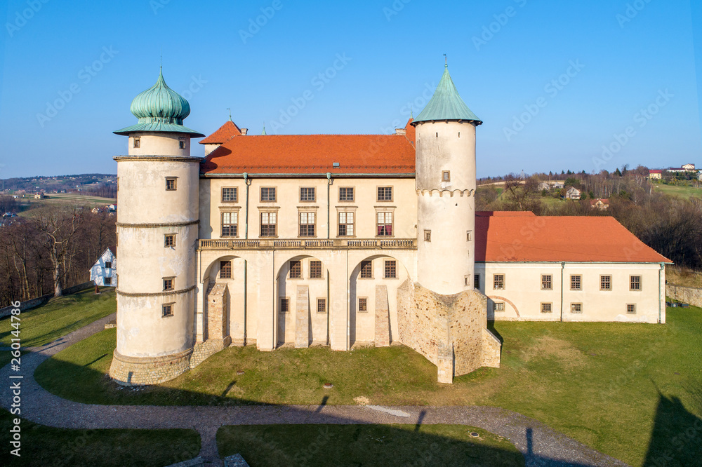 Poland. Renaissance, partly Baroque Castle on the hill in Nowy Wiśnicz. Presently owned by Polish state. Aerial view in spring. Sunset light.
