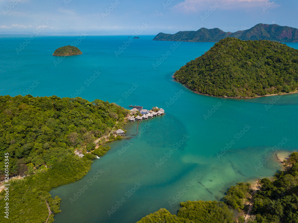 Aerial view to small Ko Ngam island on the south of Koh Chang island and Tantawan resort bungalows, Thailand