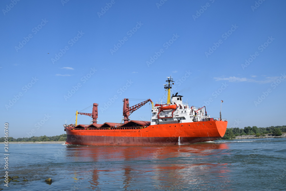 Cargo ship (bulk carrier) floats on the Danube river. Sulina, Danube Delta, Romania. Cargo ship (bulk carrier) floats on the Danube river. Sulina, Danube Delta, Romania.