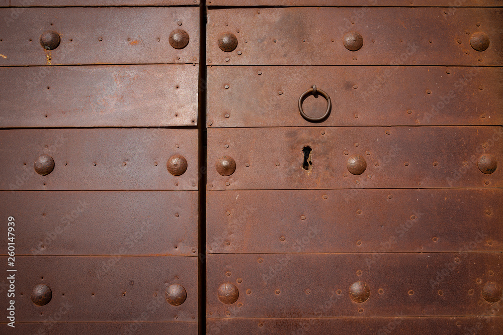 knob and lock of an ancient rusty metallic door