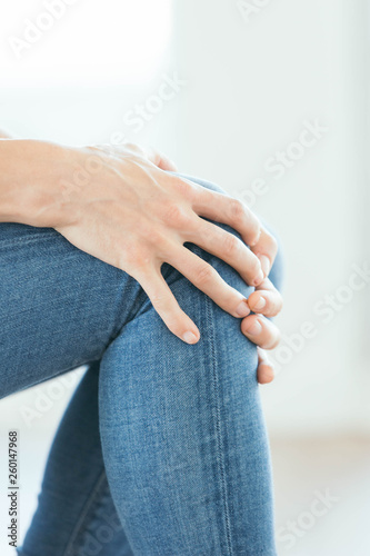 Woman Grabbing Knee in Pain