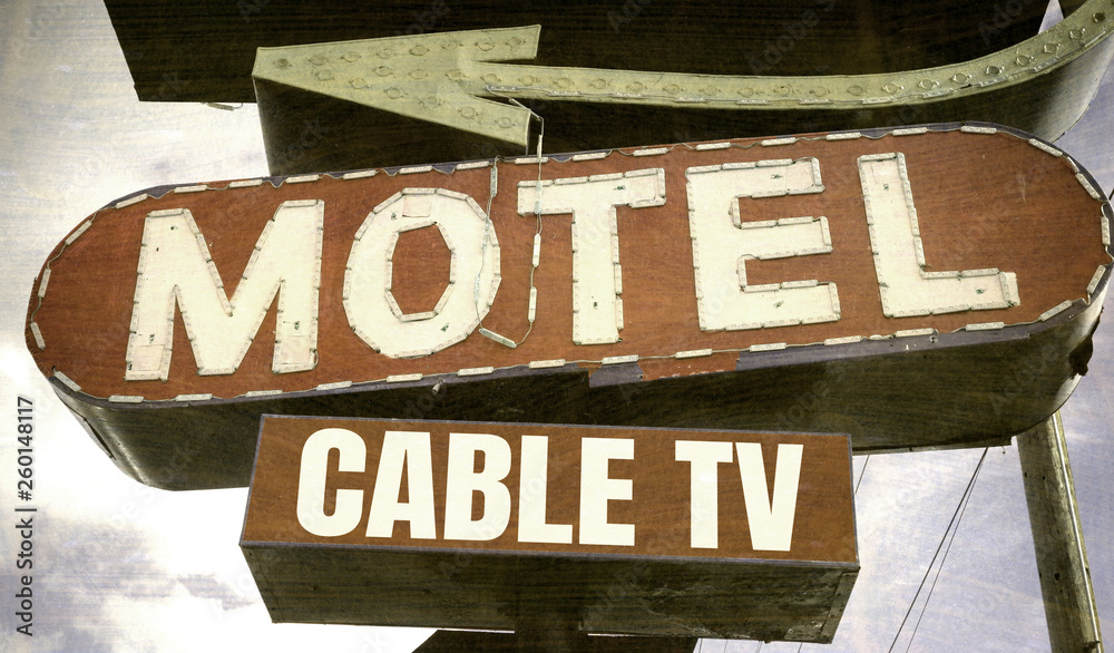 Fototapeta premium aged and worn vintage neon motel sign