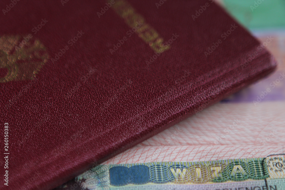 Visa stamp in passport, passport in the background. Travel concept. Close up. Visa stamp in passport, passport in the background. Travel concept. Close up.