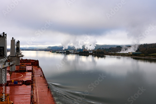 Cargo ship at beautiful Columbia river, Washington and Oregon in calm weather photo