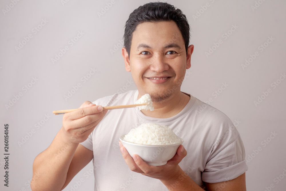 Asian Man Eating Rice StockFoto Adobe Stock