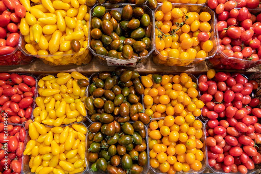 Rows of Grape Tomatoes & Cherry Tomatoes at a farmer's Market Rows of Grape Tomatoes & Cherry Tomatoes at a farmer's Market
