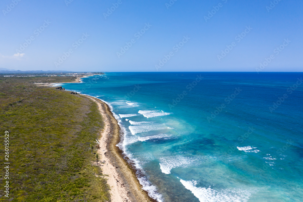 Aerial view with caribbean beach of Atlantic ocean with waves