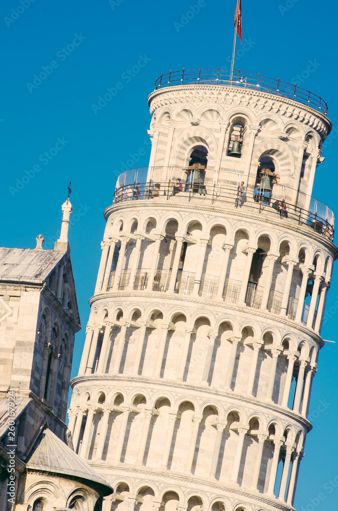 side view of the Leaning Tower of Pisa, located in the ancient Tuscan city of Pisa, Italy.