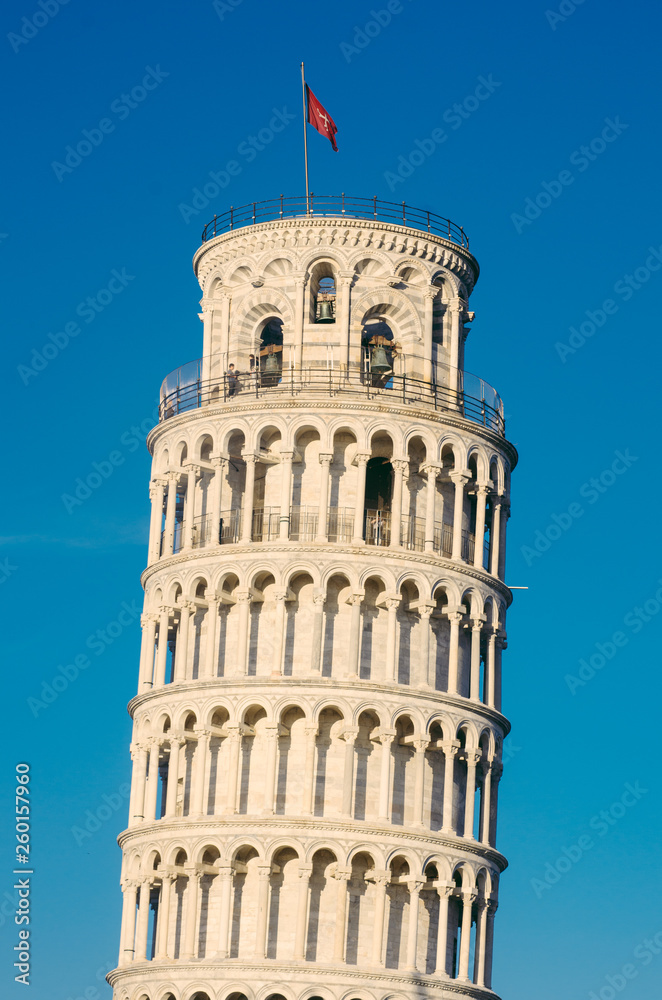 side view of the Leaning Tower of Pisa, located in the ancient Tuscan city of Pisa, Italy.