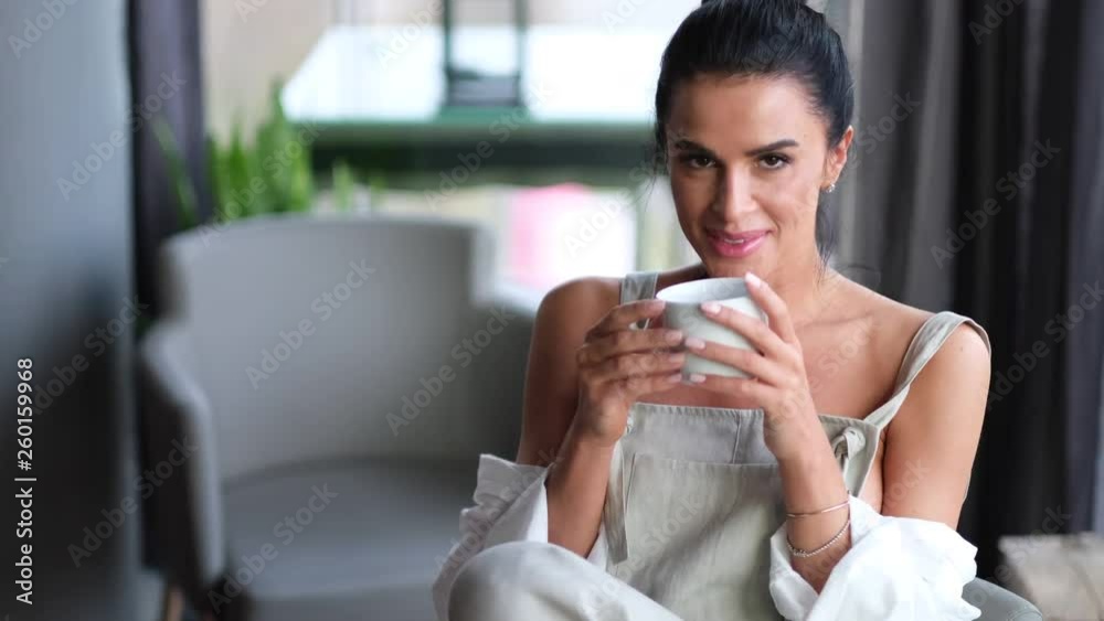 Pretty brunette model enjoying her moment with cup of coffee. Pretty brunette model enjoying her moment with cup of coffee.