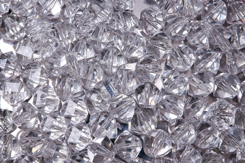 Texture of crystal rhinestones. Small stones of glass. Bijouterie. Artificial jewelry made of glass and plastic. Rhinestones For background