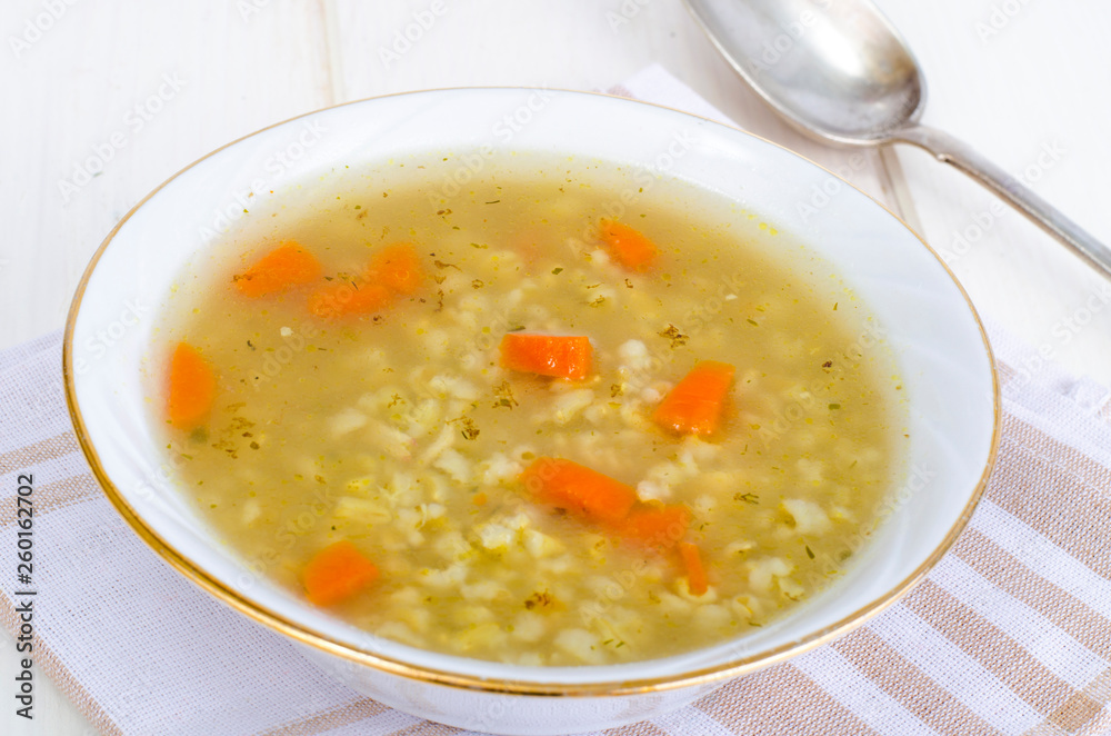 Vegetable broth with brown rice and carrots. Vegetable broth with brown rice and carrots.