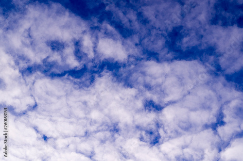 blue evening sky with white and gray clouds; cumulus. background; nature