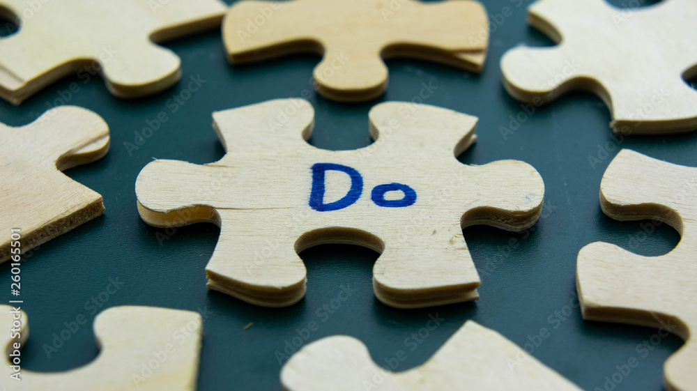 Wooden jigsaw puzzle with text Do Wooden jigsaw puzzle with text Do