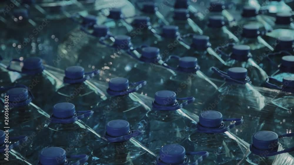 Blue plastic drinking water bottles in large quantities. Blue plastic drinking water bottles in large quantities.