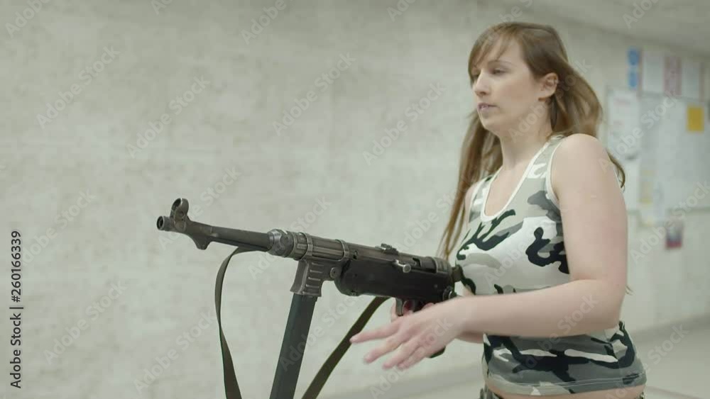 Slow Motion - Young Girl Running Aiming MP-40