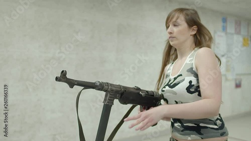 Wallpaper Mural Slow Motion - Young Girl Running Aiming MP-40 Torontodigital.ca