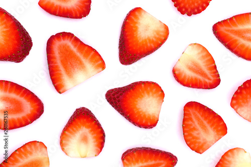 Plate of sliced strawberries isolated on white background. Strawberry berry on a white background. Neatly arranged slices of red strawberry on a white background.