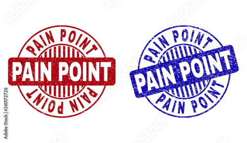 Grunge PAIN POINT round stamp seals isolated on a white background. Round seals with grunge texture in red and blue colors. Vector rubber imitation of PAIN POINT label inside circle form with stripes.