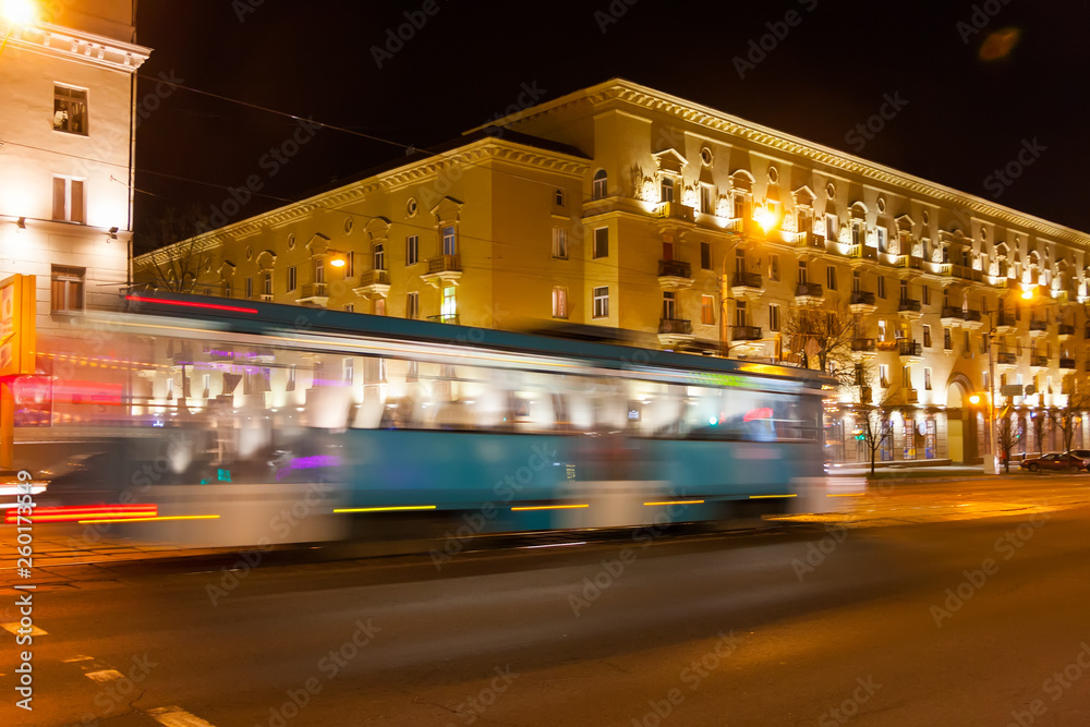 Naklejka premium The motion blurred tram in the evening.