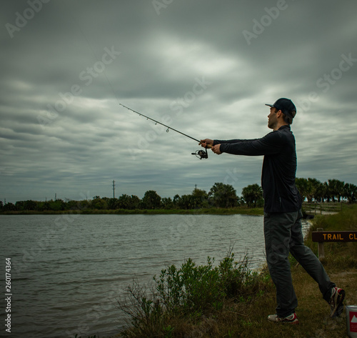 Fisherman In Action Standing Up Casting