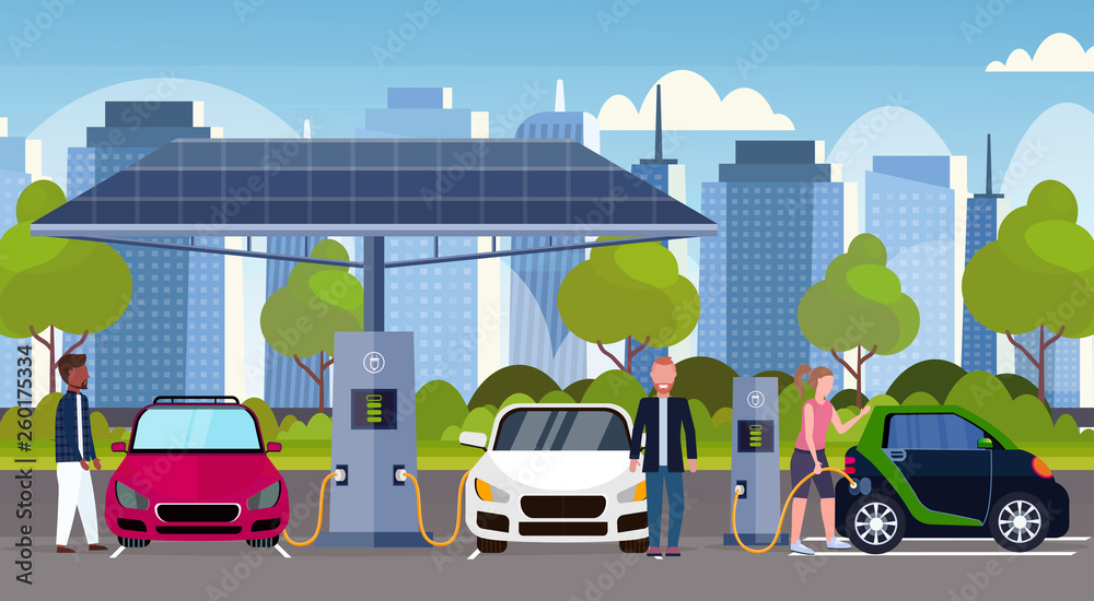 mix race people charging electric cars at electrical charge station renewable eco friendly vehicle clean transport environment care concept modern cityscape background full length