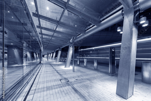 Modern pedestrian walkway in midtown of Hong Kong city at night