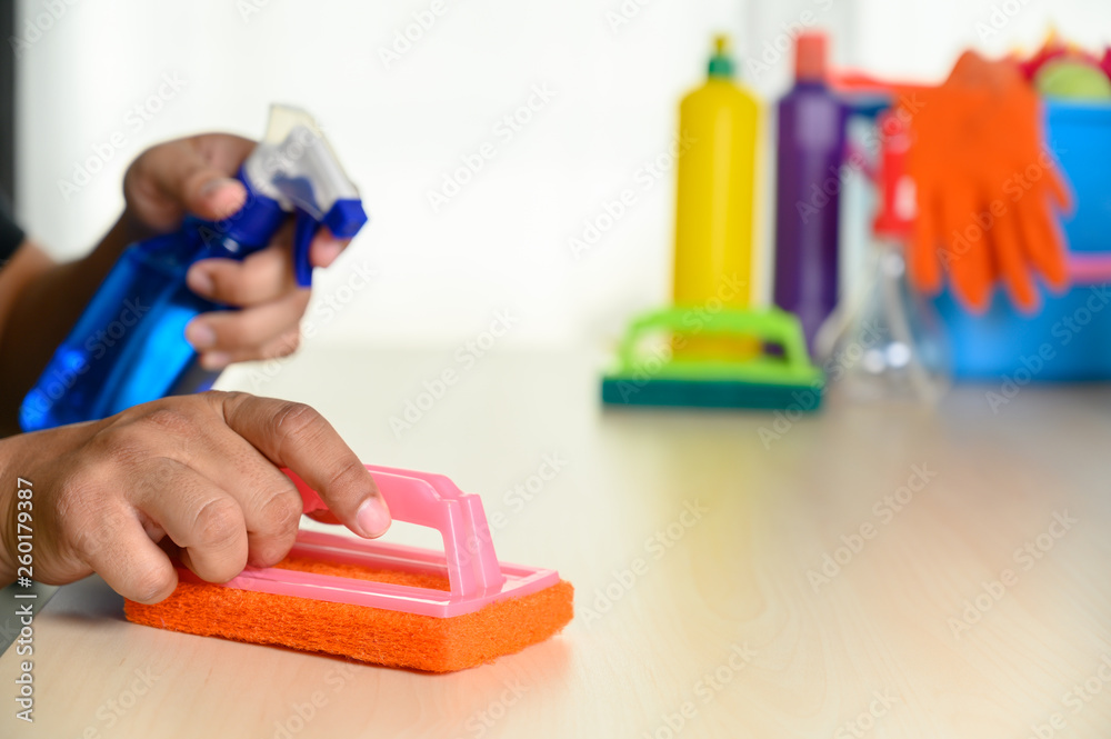 wiping dust using a spray Cleaning Desk Cleaning Apartment Cleaning service concept