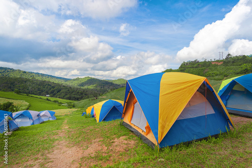 Camping tent of tourist near forest with beautiful sky in morning, Selective focus.