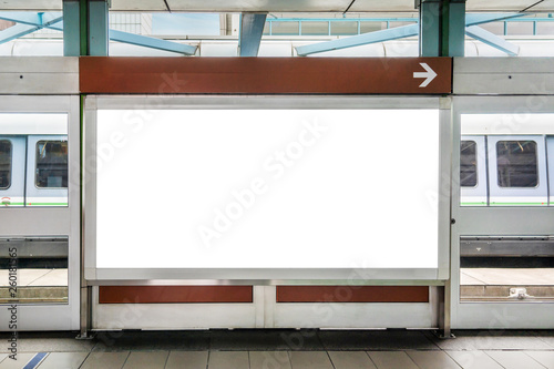 Fototapeta Naklejka Na Ścianę i Meble -  Blank billboard LCD advertisement for adjust your message in electric train station, mockup selective focus with clipping path.