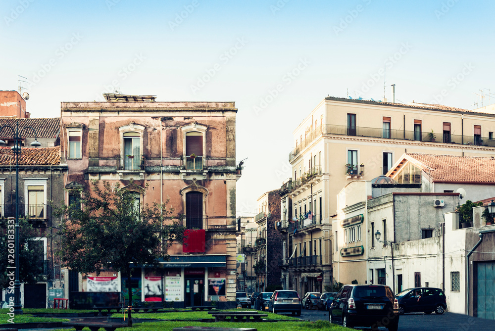Traditional architecture of Sicily in Italy, historical street of Catania, facade of old buildings.