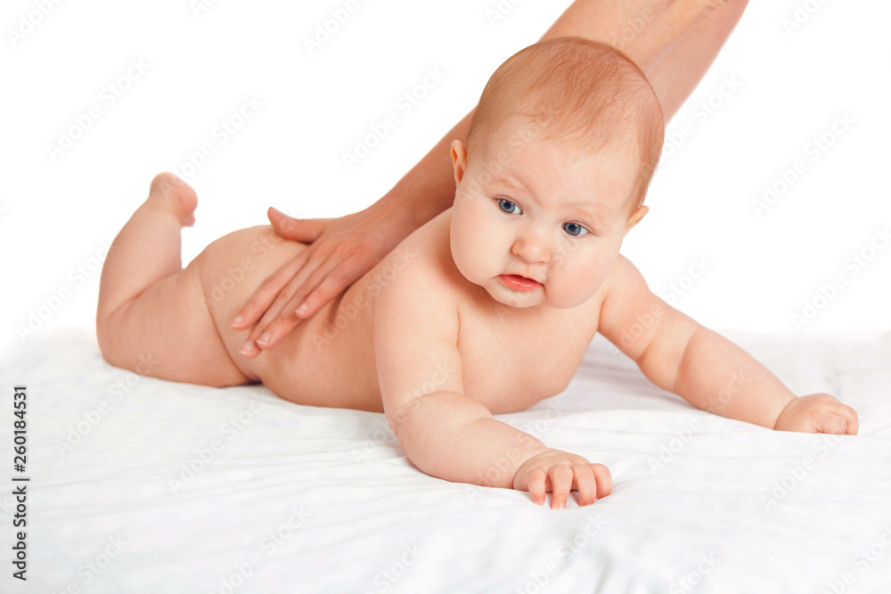 the kid loves a back massage. masseuse doing massage to the baby. child on white isolated background the kid loves a back massage. masseuse doing massage to the baby. child on white isolated background