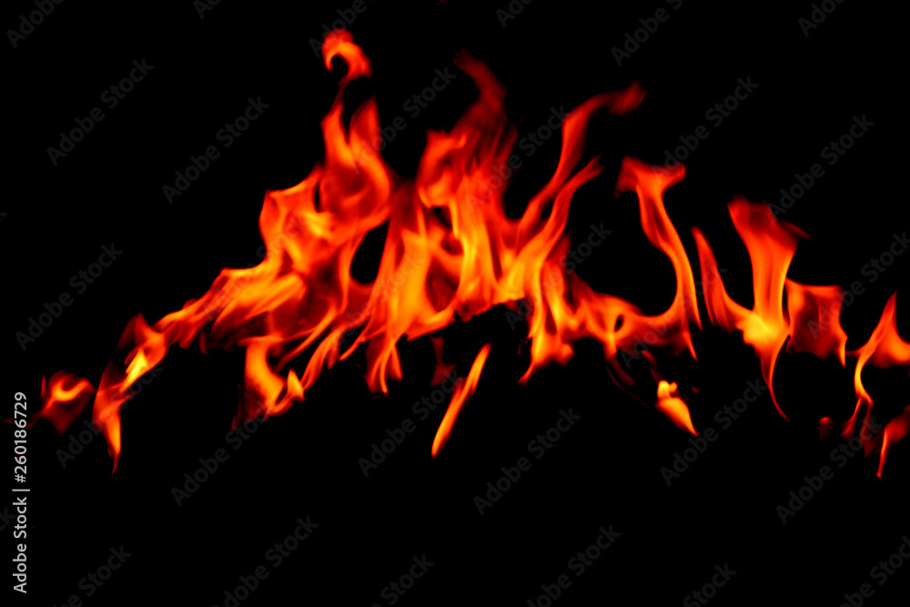 Flame burning at night on a colored background Flame burning at night on a colored background