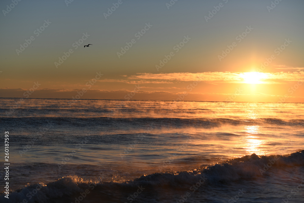 Colorful beach sunrise with a vibrant sky line Colorful beach sunrise with a vibrant sky line