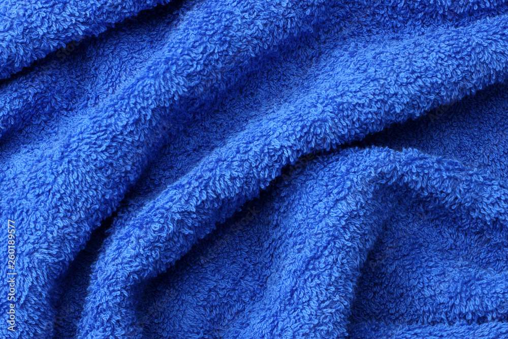 Fototapeta premium Blue beach towel texture. Blue beach towel background. Top view.