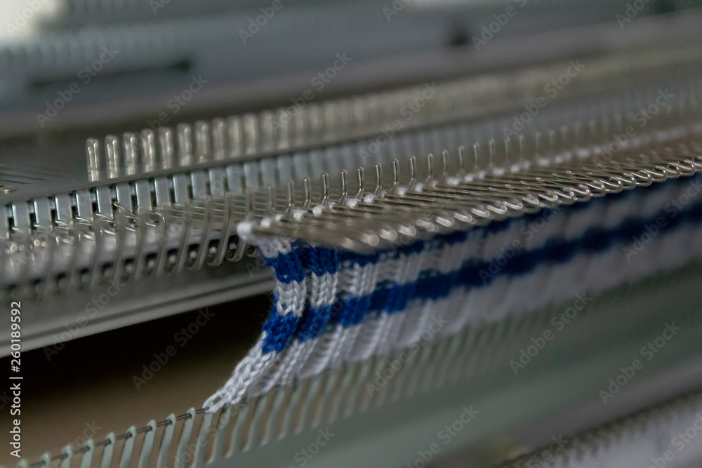 Manual knitting machine. A knitting machine is a device used to create knitted fabrics Manual knitting machine. A knitting machine is a device used to create knitted fabrics