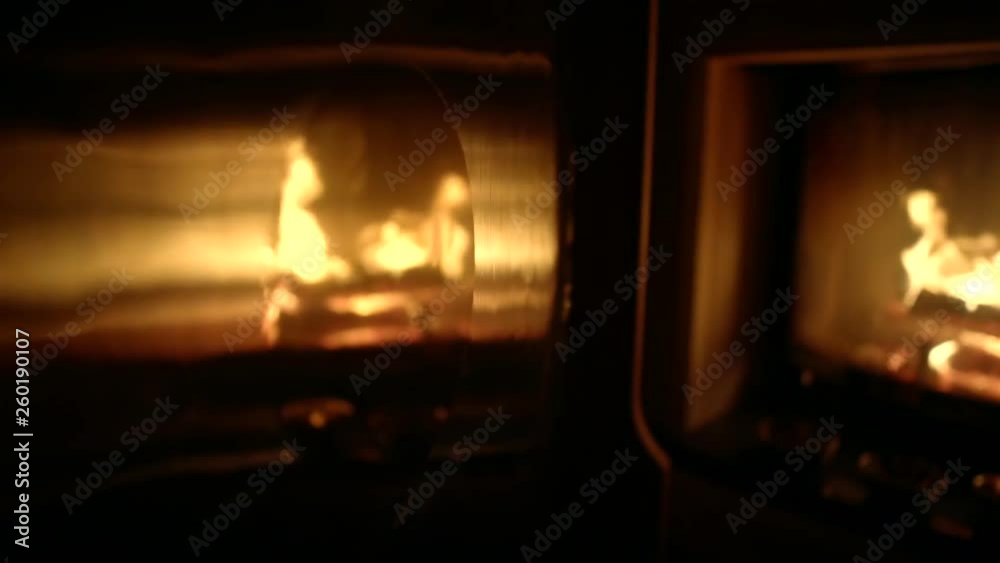bronze traditional gong is swaying by hit of wooden hammer in dark room, fireplace is reflecting bronze traditional gong is swaying by hit of wooden hammer in dark room, fireplace is reflecting