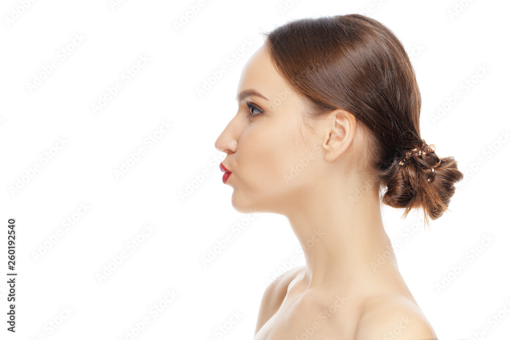 Lovely girl looking away, standing in profile and giving a virtual kiss Lovely girl looking away, standing in profile and giving a virtual kiss