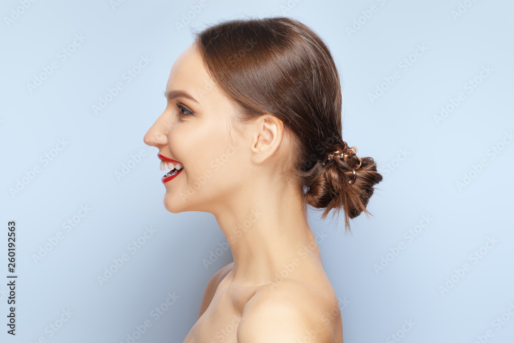 Lovely girl looking away, standing in profile and giving a virtual kiss Lovely girl looking away, standing in profile and giving a virtual kiss
